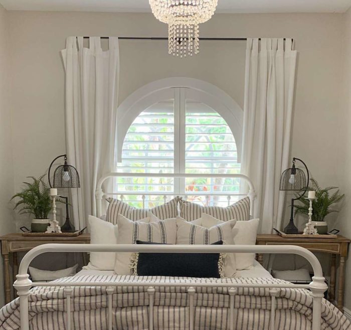 Arched window with plantation shutters